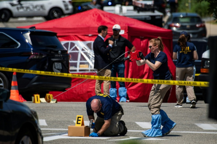 Des agents du FBI enquêtent à l'endroit où un homme a été tué par un agent de l'ICE à Biddeford dans le Maine, le 13 juillet 2026 ( AFP / Joseph Prezioso )