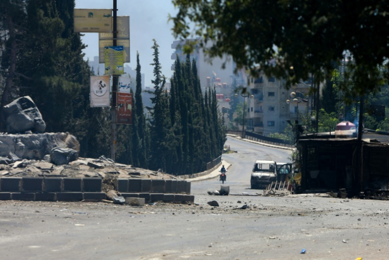 Une rue dévastée après deux jours de violences à Soueida, dans le sud de la Syrie, le 15 juillet 2025 ( AFP / Bakr ALKASEM )