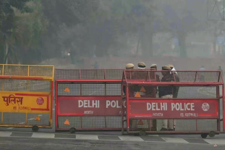 Des des membres des forces de sécurité sur les lieux d'une explosion à Ne Delhi, le 11 novembre 2025 en Inde ( AFP / Arun SANKAR )