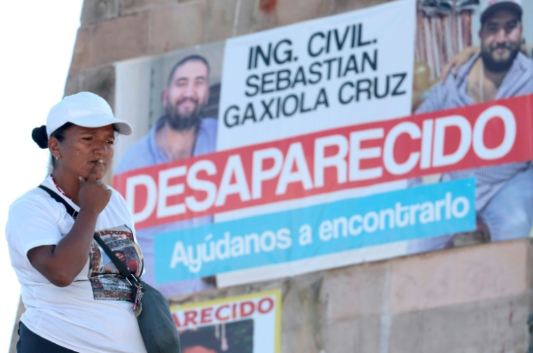 Une femme assiste à une messe à la mémoire des disparus à Guadalajara, dans le Jalisco, nord-ouest du Mexique, le 14 mars 2025 ( AFP / ULISES RUIZ )