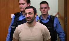Co-defendant Armenian identified as Vardges I., is led into the courtroom  ( POOL / STF )