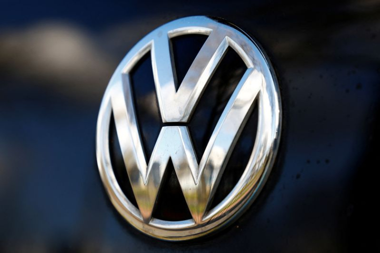 A logo of Volkswagen is seen inside a car dealer in Nijmegen