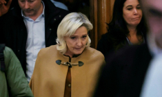 President of the parliamentary group of the French far-right Rassemblement National (RN) party, Marine Le Pen (C) leaves after a break during her appeal trial on charges of embezzlement of European public funds in a case of alleged European Parliament fake jobs at the Palais de Justice in Paris on February 3, 2026. Le Pen is called to the stand in the appeal trial in Paris of the parliamentary assistants of the National Front, where she is playing for her candidacy for the 2027 presidential election. Twelve of the accused, as well as the far-right party itself, have appealed against the verdict while another 12 people -- including one of Le Pen's sisters -- have decided to accept their convictions without appealing. The public prosecutor's office is expected to announce its charges against Marine Le Pen, the National Rally party, and ten party officials on February 3, 2026. ( AFP / Thomas SAMSON )