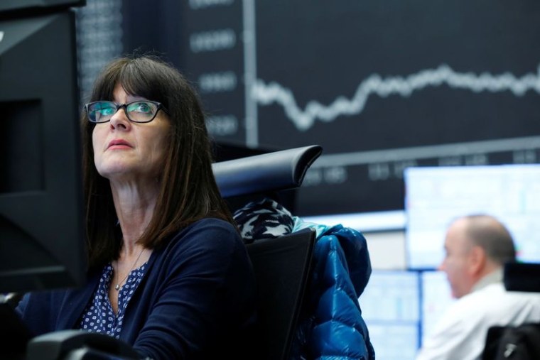 A trader works at Frankfurt's stock exchange in Frankfurt