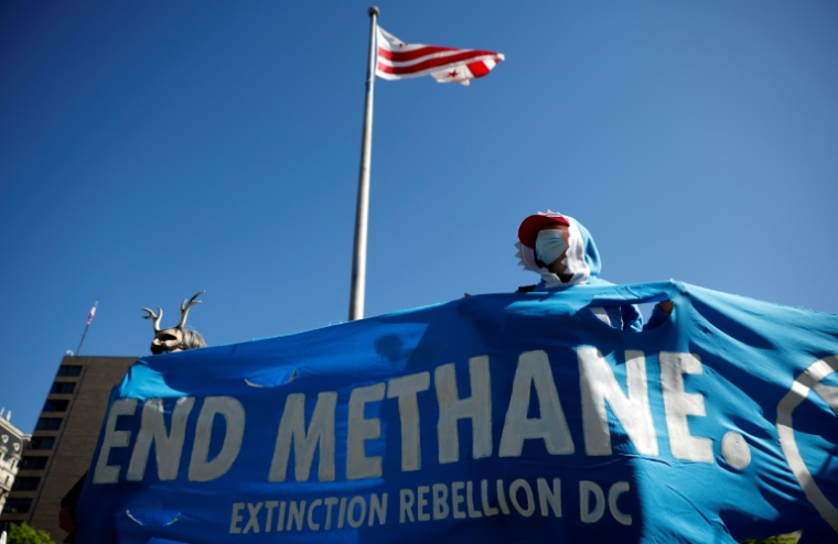 Mobilisation de membres du collectif de défense de l'environnement Extinction Rebellion pour demander la fin des émissions de méthane dans l'atmosphère, lors du Jour de la Terre le 22 avril 2024 à Washington ( GETTY IMAGES NORTH AMERICA / Kevin Dietsch )