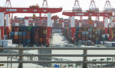 Gantry cranes stand near shipping containers at Yangshan Port outside of Shanghai