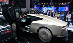 A prototype of Tesla's Cybercab seen at the 8th International Import Expo in Shanghai in November 2025 ( AFP / Hector RETAMAL )