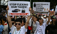 Des manifestants contre un scandale de corruption autour d'infrastructures "fantômes" aux Philipppines, à Manille le 21 septembre 2025 ( AFP / Jam STA ROSA )
