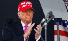 FILE PHOTO: U.S. President Donald Trump wears a 'Make America Great Again' (MAGA) hat