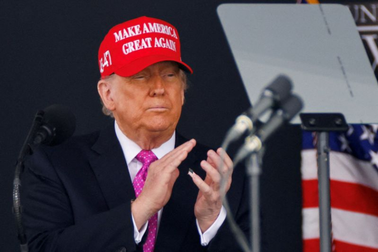 FILE PHOTO: U.S. President Donald Trump wears a 'Make America Great Again' (MAGA) hat