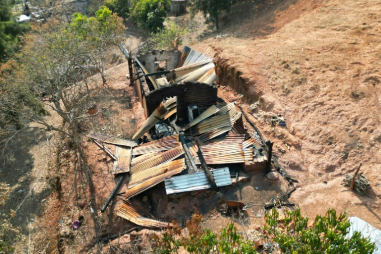 This aerial view shows a house destroyed by a bombing of alleged members of Los Ardillos drug cartel in Alcozacan, Guerrero state, Mexico on May 20, 2026. The barking of dogs broke the silence in an indigenous community in Mexico. Drug traffickers arrived suddenly, opened fire on the villagers, bombarded their homes with drones and drove them out. Nothing was left. Tula lay in ruins, and its animals are starving. The attack was attributed to Los Ardillos, a criminal gang involved in drug trafficking, extortion and kidnapping in Guerrero. ( AFP / YURI CORTEZ )