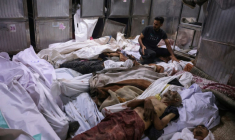 Des corps de Palestiniens tués dans le nord de la bande de Gaza en attendant de l'aide, entreposés à l'hôpital al-Chifa, le 31 juillet 2025 ( AFP / Bashar TALEB )