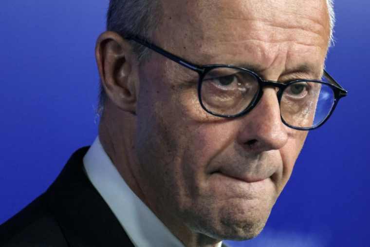 le chancelier allemand Friedrich Merz, le 12 février 2026 à Rijkhovenn en Belgique ( AFP / Ludovic MARIN )