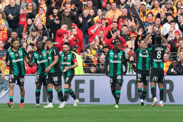 La joie des joueurs du Racing Club de Lens contre le FC Metz au stade Bollaert-Delelis le 8 mars 2026 ( AFP / Francois LO PRESTI )
