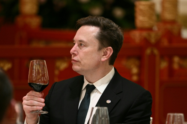Elon Musk, PDG de Tesla et SpaceX, participe à un banquet d'Etat au Palais de l'Assemblée du Peuple à Pékin, le 14 mai 2026 ( AFP / Brendan SMIALOWSKI )