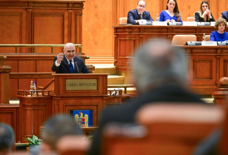 Le Premier ministre roumain sortant Ilie Bolojan au Parlement à Bucarest le 5 mai 2026 ( AFP / Daniel MIHAILESCU )