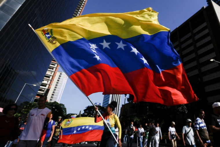 Manifestation pour la libération du président vénézuélien déchu Nicolas Maduro, le 3 février 2026 à Caracas ( AFP / Pedro MATTEY )