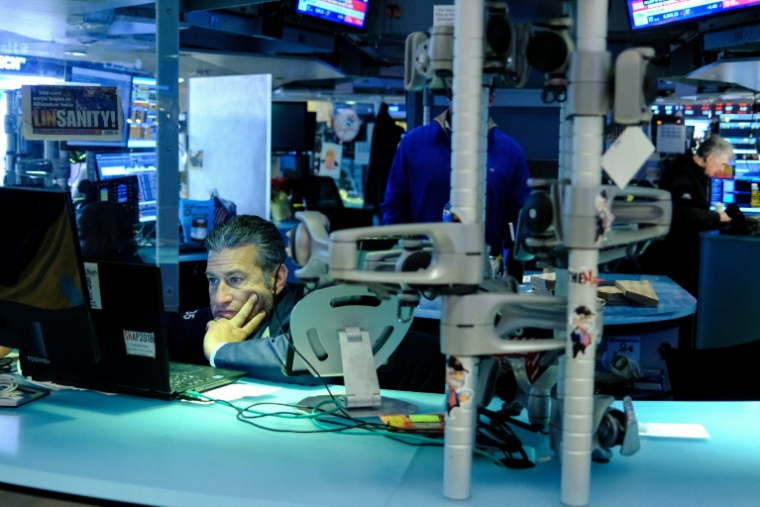 Un opérateur à la Bourse de New York, le 16 décembre 2025 ( AFP / CHARLY TRIBALLEAU )