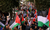 Des Palestiniens rassemblés à Ramallah, en Cisjordanie occupée par Israël, le 23 septembre 2025, pour exprimer leur soutien au président Mahmoud Abbas et pour exprimer leur soutien aux pays reconnaissant officiellement l'État de Palestine ( AFP / Zain JAAFAR )
