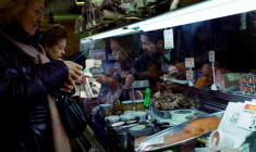 Customers shop in a supermarket as the Spanish government announces measures to battle inflation in Madrid