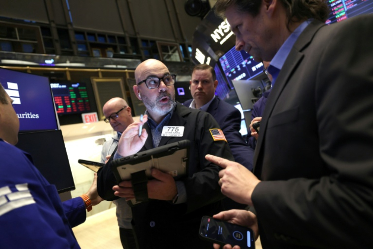 Des opérateurs à la Bourse de New York le 12 mars 2026 ( AFP / TIMOTHY A. CLARY )