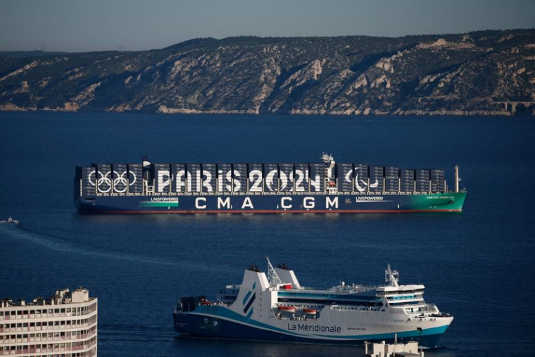 The CMA CGM Greenland container ship is seen at sea with Paris 2024 and the Olympic rings on it during the Olympics torch relay ahead Paris 2024 Olympic games