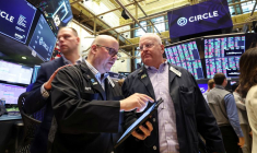 Traders work on the floor of the NYSE in New York