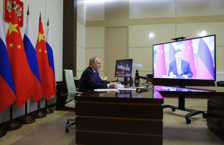 Le président russe Vladimir Poutine en visioconférence avec son homologue chinois Xi Jinping le 21 janvier 2025 ( POOL / Gavriil Grigorov )