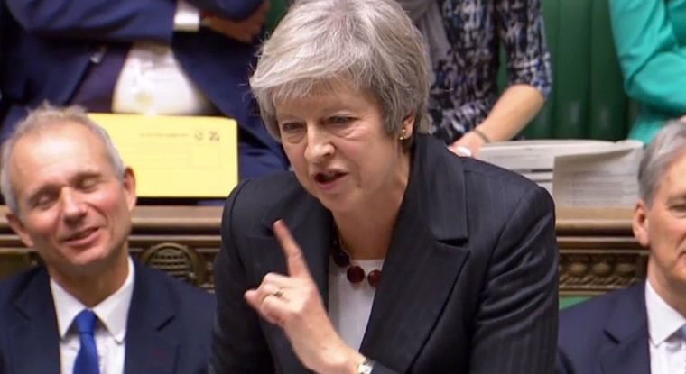 Theresa May a defendu son projet d'accord malgré les attaques venant de toute part. (© Ho / AFP)