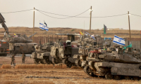 Des troupes israéliennes déployées près de la bande de Gaza, le 13 mai 2025 ( AFP / Menahem Kahana )