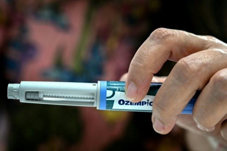 Du côté des pistes à approfondir, des données très préliminaires mais encourageantes ont été présentées sur un potentiel effet sur le cancer des médicaments populaires anti-obésité comme Ozempic ou Wegovy ( AFP / Indranil MUKHERJEE )