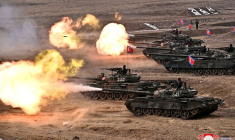 North Korean leader Kim Jong Un guides a military demonstration involving tank units