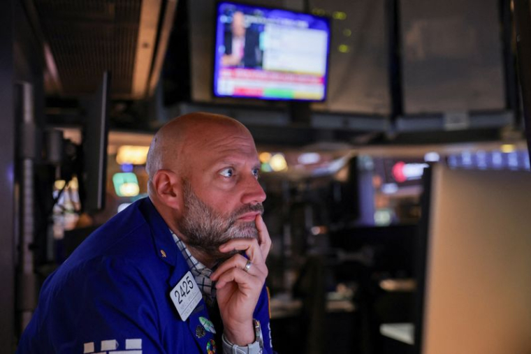 A trader works on the floor at the New York Stock Exchange (NYSE) in New York City