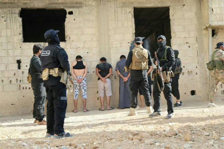 Photo diffusée par l'agence de presse officielle syrienne Sana, le 23 juin 2025, d'une opération de sécurité à Damas au lendemain d'un attentat-suicide contre une église orthodoxe ( SANA / - )