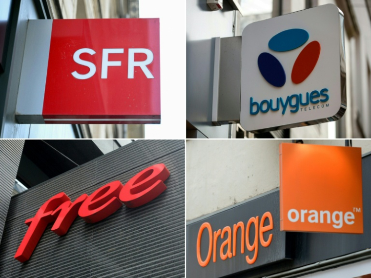 Bouygues Telecom, Free et Orange ont adressé mardi une offre commune de rachat de "la plupart des actifs de l'opérateur SFR", pour 17 milliards d'euros. ( AFP / EMMA DA SILVA )