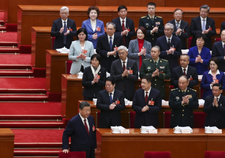Le dirigeant chinois Xi Jinping (en bas) assiste à l'événement politique des "Deux Sessions", à Pékin, le 5 mars 2026 ( POOL / Florence Lo )