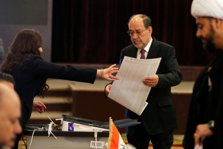 L'ancien Premier ministre Nouri al-Maliki dans un bureau de vote à Bagdad, le 11 novembre 2025, lors des élections législatives en Irak ( AFP / AHMAD AL-RUBAYE )
