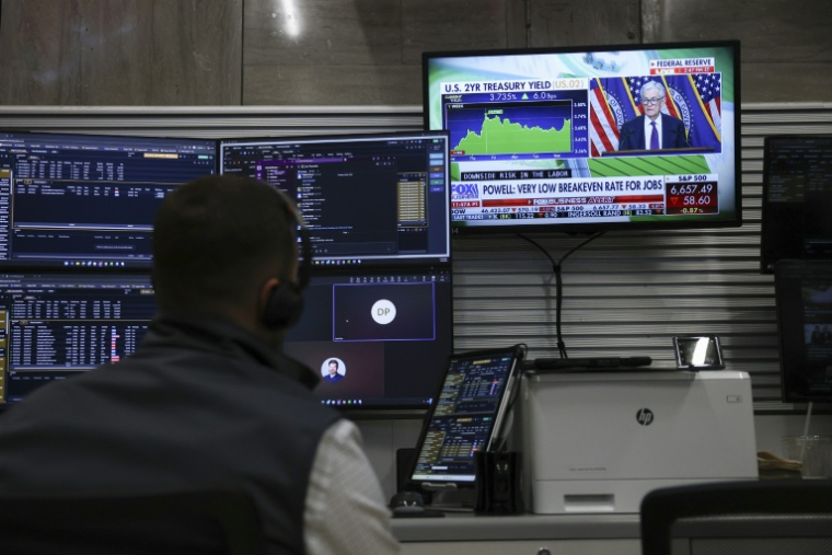 Un opérateur à la Bourse de New York, le 18 mars 2026 ( AFP / ANGELA WEISS )