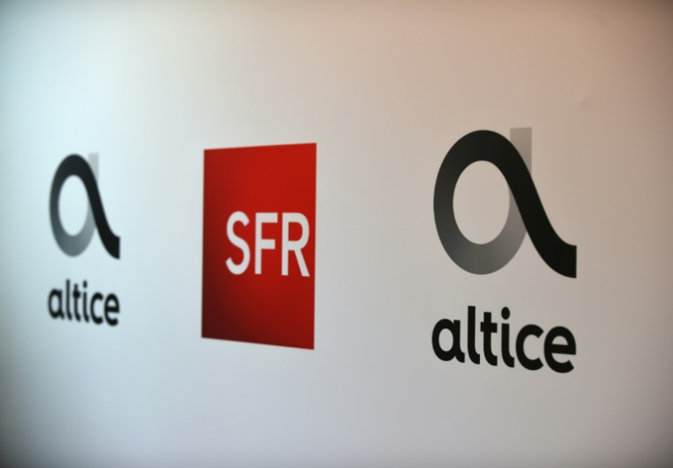Le groupe de télécommunications Altice France, maison mère de l'opérateur SFR, s'apprête à voir passer sa dette de plus de 24 milliards à 15,5 milliards d'euros ( AFP / ERIC PIERMONT )