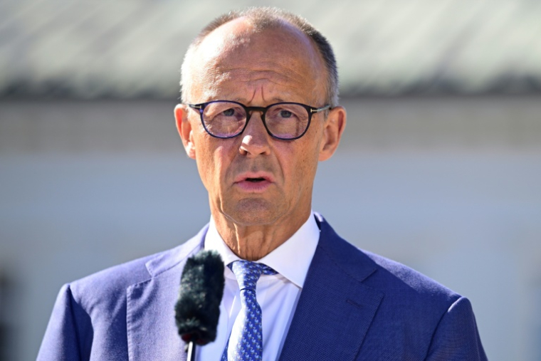 Le chancelier Friedrich Merz s'exprime lors d'un séminaire gouvernmental à Neuhardenberg, à l'est de Berlin, 25 août 2026 ( AFP / John MACDOUGALL )