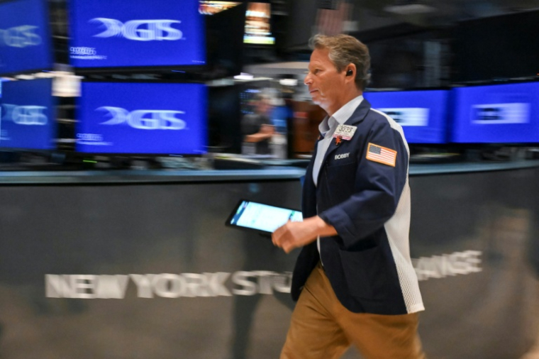 Trader, à l'ouverture sur le parquet du New York Stock Exchange le 12 mai 2025. ( AFP / ANGELA WEISS )