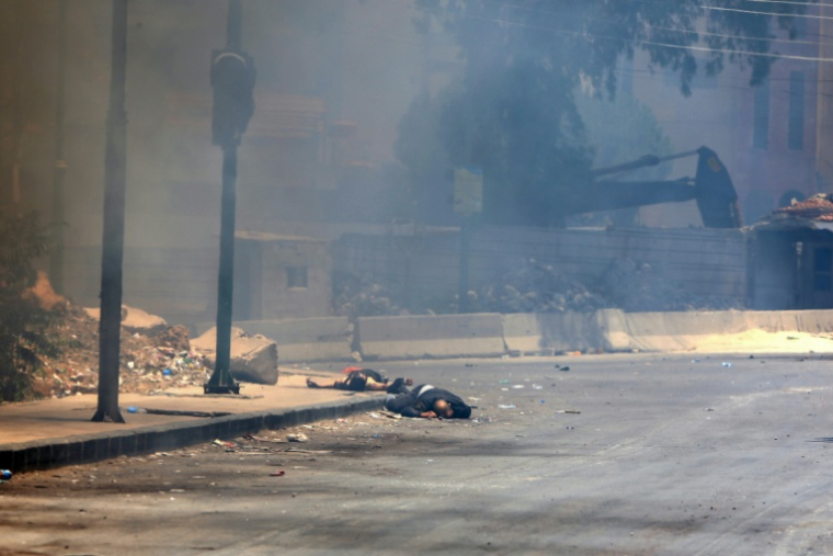 Des corps gisent dans une rue de Soueida, dans le sud de la Syrie, après l'entrée des forces gouvernementales le 15 juillet 2025 ( AFP / Bakr ALKASEM )