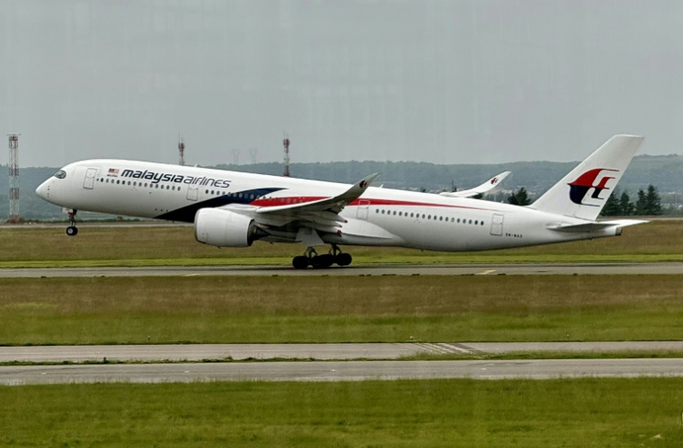 Un pilote de ligne malaisien a été arrêté cette semaine à l'aéroport de Jakarta avec plus de 70.000 comprimés d'ecstasy dans sa valise et sous l'emprise de plusieurs drogues ( AFP / Daniel SLIM )