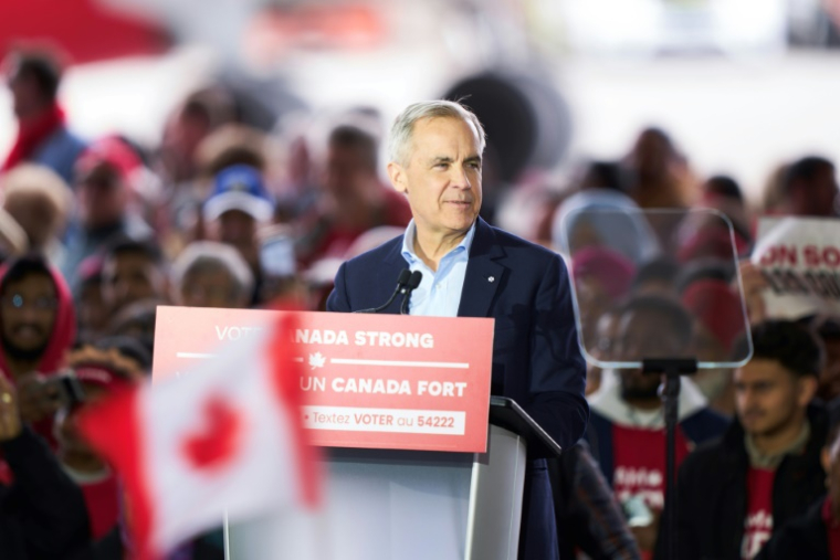Le Premier ministre canadien et candidat libéral, Mark Carney, à Mississauga en Ontario, lors d'un meeting le 26 avril 2025. ( AFP / Geoff Robins )