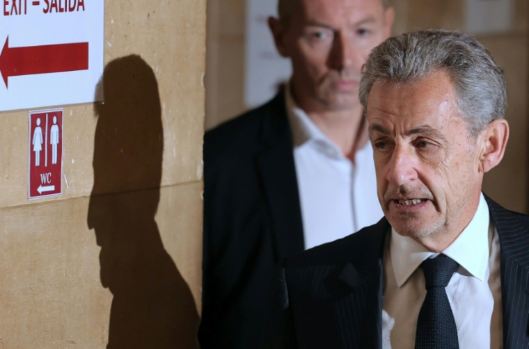 L'ancien président Nicolas Sarkozy arrive au palais de justice de Paris, le 7 avril 2026, pour son procès en appel dans l'affaire d'un financement libyen présumé de sa campagne présidentielle de 2007 ( AFP / Thomas SAMSON )