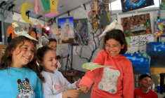 During the sessions, children are able to pet birds, a rabbit, a small tortoise, a hedgehog and a fluffy white dog ( AFP / Eyad Baba )