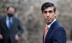 FILE PHOTO: Britain's Chancellor of the Exchequer Rishi Sunak looks on as he leaves following an outside broadcast interview, in London