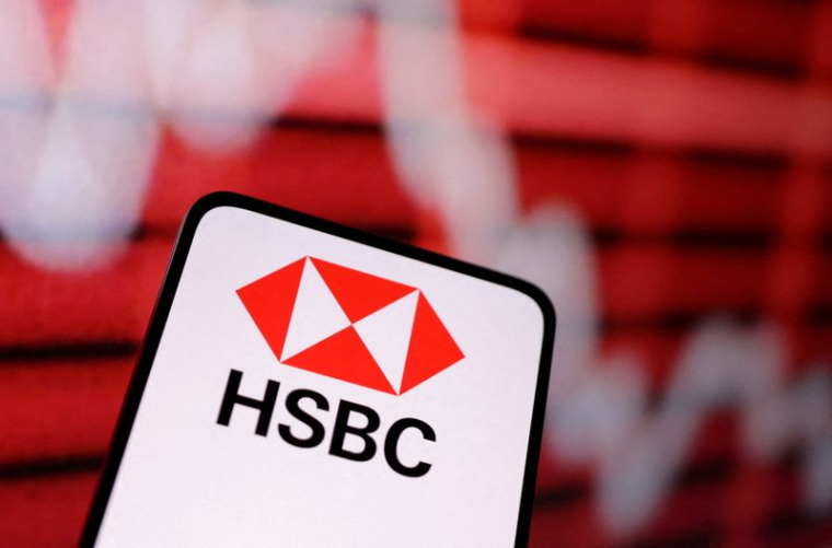 L'illustration montre le logo de la banque HSBC et un graphique boursier décroissant