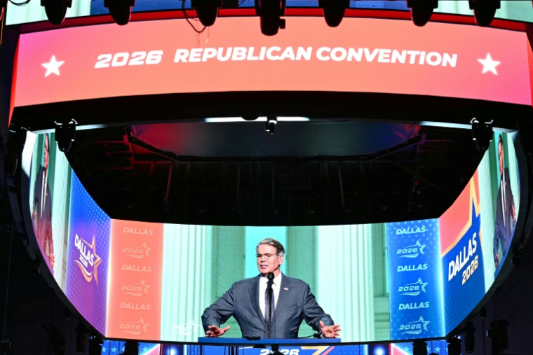 US Treasury Secretary Scott Bessent is seen on a giant screen during preparations ahead of the Republican National Committee (RNC) Midterm Convention at the American Airlines Center in Dallas, Texas on September 8, 2026.  The convention, announced by Trump as the first national Republican gathering held during a midterm election year, is expected to draw the president alongside Vice President JD Vance and other Republican leaders as the party looks to rally voters ahead of a hard-fought battle for control of Congress in November. ( AFP / Kent NISHIMURA )