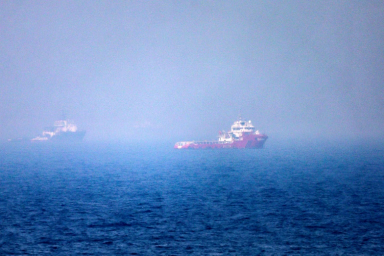 Navires dans le détroit d'Ormuz, au large de Khor Fakkan, plus grand port des Émirats arabes unis, le 13 juillet 2026. ( AFP / - )